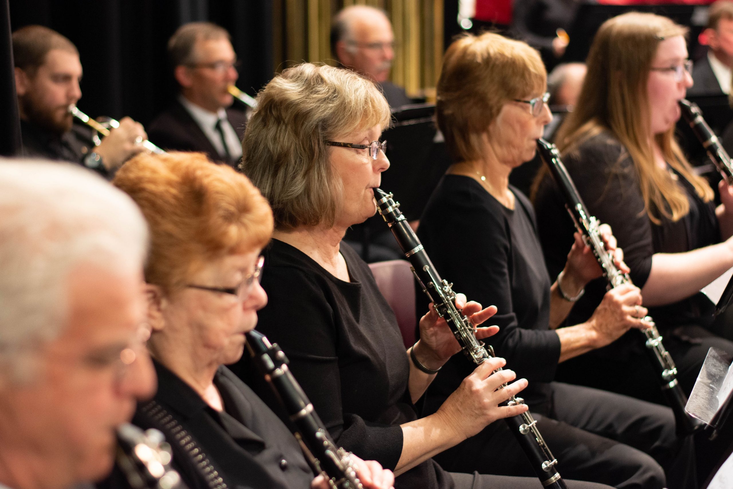 Clarinet section of Willamette Valley Concert Band playing during a formal concert